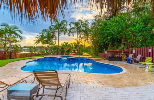 Lake Worth House | Lakefront Oasis for Gatherings - Heated Pool Tiki Huts Game Room Sleep 14