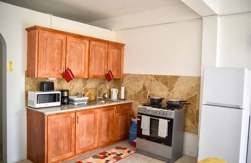 Castle Comfort Apartment | Large 2 Bedroom 2 Bathroom Apartment #4 in Roseau. Bus stops right in front!