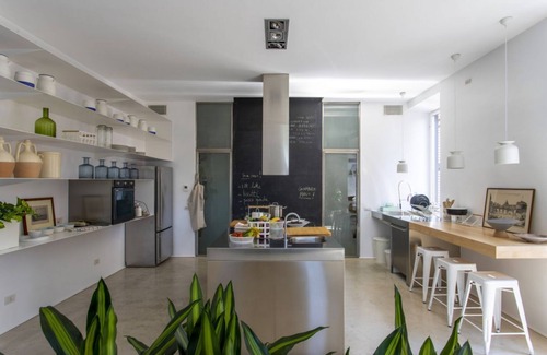 Esquilino Apartment | Large and bright 200sqm apartment, able to accommodate up to 7 people, located on the 3rd floor with elevator (not suitable for disabled people) of a building dating back to the 19th century. The property overlooks Piazza Fanti's garden and is located in