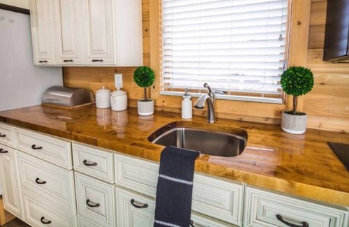 Apple Valley Cabin | Large tiny home with roof private roof top deck and BBQ.