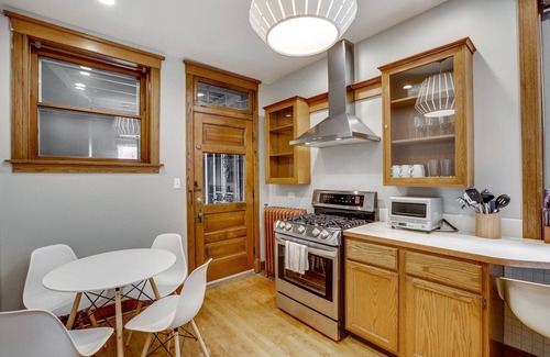 North Center Apartment | Light Filled with Tasteful Pops of Color - You Will Love This Mid-Century Modern Gem by AllSet Turnover