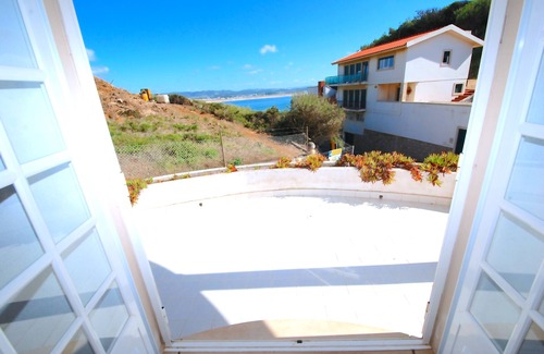 Sao Martinho do Porto House | Lighthouse - 3 story holiday home with shared tennis court and sea views