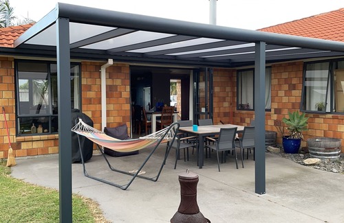 Papamoa Beach House | LOCATION. Close to the beach, reserve and shops. Fenced yard with a Spa.