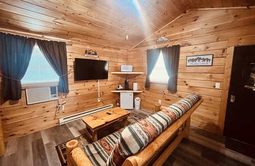 Thompsonville Cabin | Log Cabin with Hot Tub 2 Miles from Crystal Mountain!