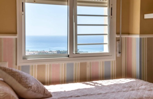 Benagalbon Apartment | Look forward to this family-friendly and colorful vacation apartment with sea view.