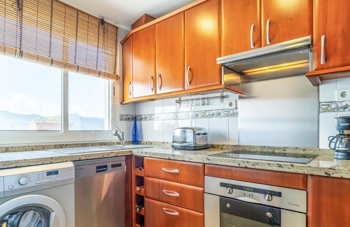 Benagalbon Apartment | Look forward to this family-friendly and colorful vacation apartment with sea view.