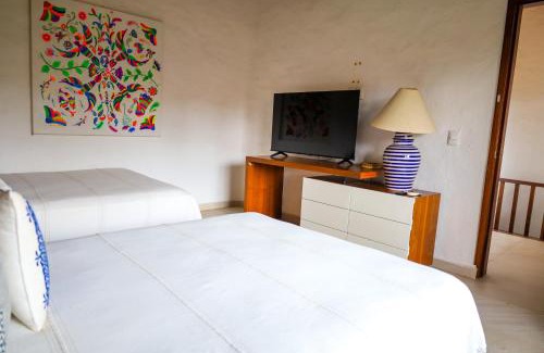 South Hotel Zone Hotel | Los Tules 501 one bedroom apartment with ocean views and lush palm gardens