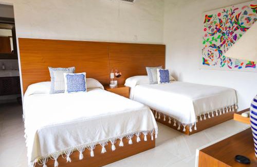 South Hotel Zone Hotel | Los Tules 501 one bedroom apartment with ocean views and lush palm gardens