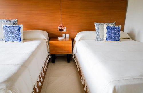 South Hotel Zone Hotel | Los Tules 501 one bedroom apartment with ocean views and lush palm gardens