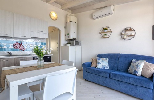 Paduledda Apartment | Lovely apartment for 4 people with A/C, pool, TV, terrace and pets allowed