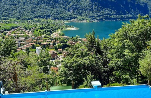Porlezza House | Lovely apartment in villa for 4 guests with WIFI, pool, TV, patio and pets allowed