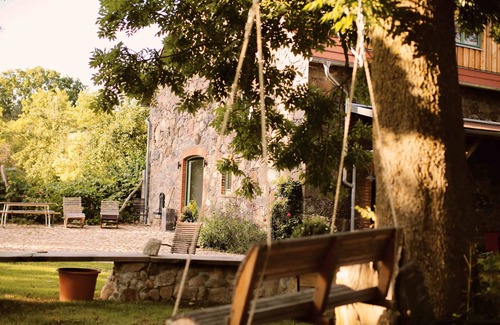Klosterdorf House | Lovingly restored fieldstone barn with fireplace and woodchip heating.