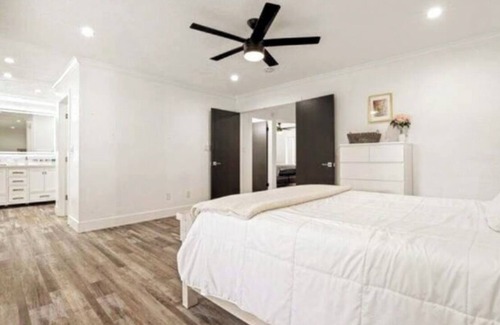 Modesto House | Lux Home wall-to-wall shower with nine heads ensuring a luxurious experience.