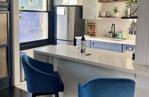 Downtown Long Beach Condo | Luxe Suite one bedroom with free parking, balcony and partial ocean view.