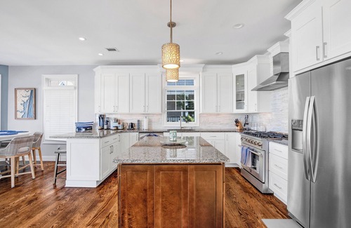 Normandy Beach House | Luxurious 6 bedroom 4.5 bath Waterfront Oasis with Bay Views in Normandy Shores