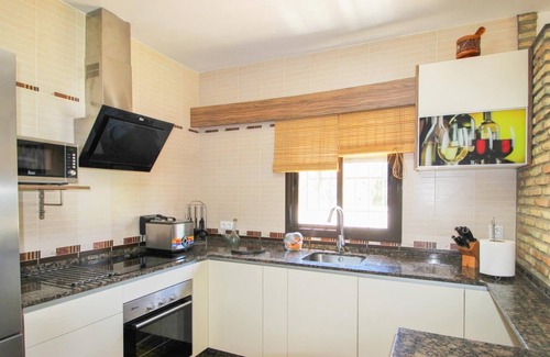 Conil de la Frontera House | luxurious villa in quiet surrounding for 6 guests with large pool and precious terraces and nice bbq-area and seaview in the distance