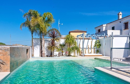 Conil de la Frontera House | luxurious villa in quiet surrounding for 6 guests with large pool and precious terraces and nice bbq-area and seaview in the distance