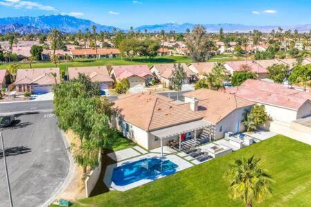 Indio House | Luxurious Getaway Near Coachella Stagecoach Pool Putting Green Parking Firepit Sleeps 11