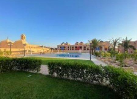 Zafarana Apartment | Luxurious ground chalet with a private garden and pool view.