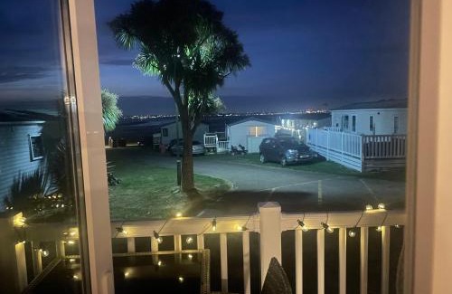 Isle of Grain Apartment | Luxury family Caravan with decking and a sea view at Kent coast sleeps 6