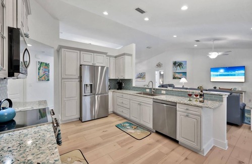 Pelican House | Luxury Gulf Access Pool Home With Large Tiki Hut Close to Tarpon Point Marina