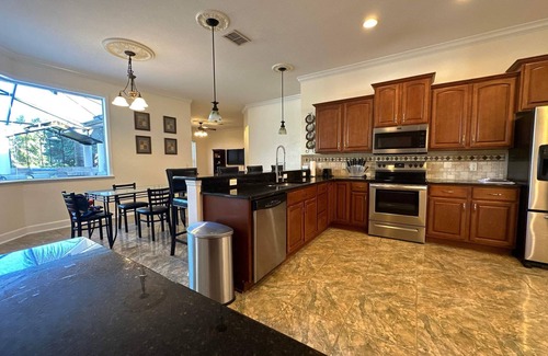 Lakeland House | Luxury home with heated pool & hottub! Close to golf, beach, & amusement parks.