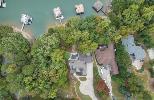 Buford House | Luxury Lakefront retreat. Privacy gate, pool and outdoor kitchen