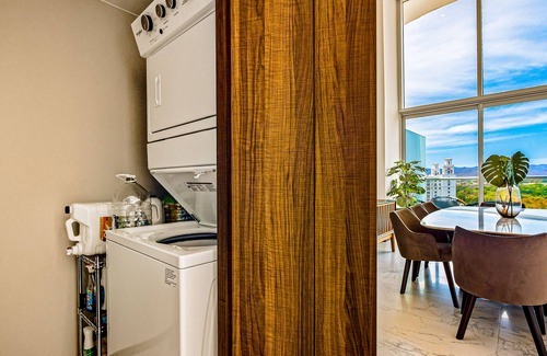 Flamingos Condo | Luxury ocean-view condo with resort pool, private balcony, and washer/dryer