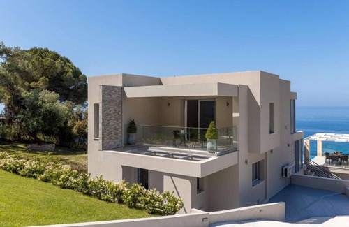 Agios Matthaios Villa | Luxury villa, coastal setting, sea views.