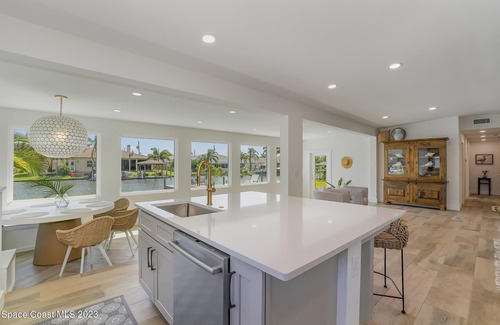 Cocoa Beach House | Luxury Waterfront -Heated Pool, Dock, Bikes & Paddleboards - Mins to Beach