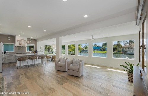 Cocoa Beach House | Luxury Waterfront -Heated Pool, Dock, Bikes & Paddleboards - Mins to Beach