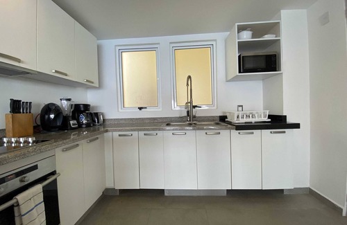 Brisas del Marques Condo | Magical sunsets, king bed, and pro service B403