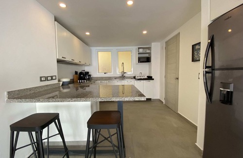 Brisas del Marques Condo | Magical sunsets, king bed, and pro service B403