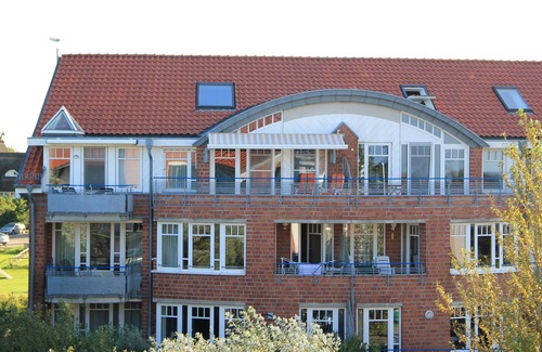 Dorumer Neufeld Apartment | Maritime country house style with sea view - swimming pool, sauna & WLAN included