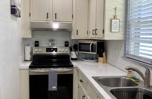 Ash Apartment | Meander on Down first floor Beach House steps to the beach