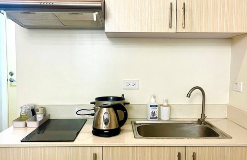 Sasa Condo | Minimalist Studio condo unit near Davao International Airport with AC, WiFi