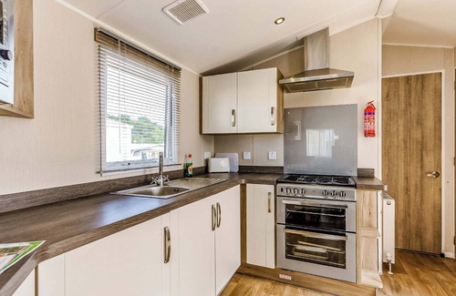 Bleadon House | Modern and contemporary 12ft-wide caravan with one double and two twin.