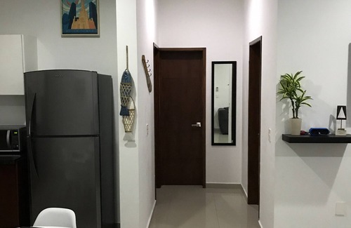 Zona Dorada Condo | Modern Apt 1st level with rooftop 5 min from the beach. (WiFi,Cable,AC,Boiler)