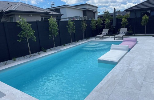 Papamoa Beach House | Modern Beachside Oasis with Private Heated Pool - Pet Friendly!