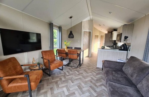 Municipality of Epe Apartment | Modern chalet retreat with spacious garden in the Veluwe.