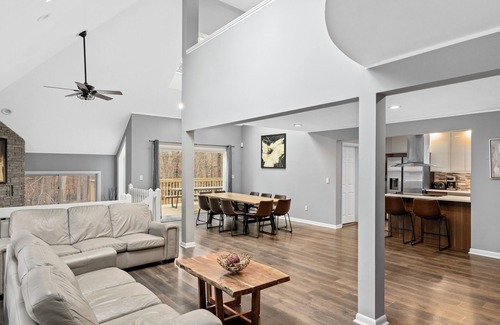 Bushkill House | Modern Creek-front House with Volleyball court in the backyard.