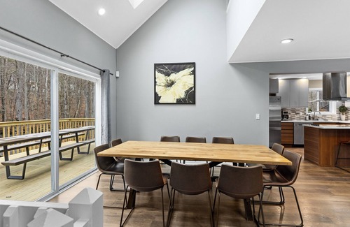 Bushkill House | Modern Creek-front House with Volleyball court in the backyard.