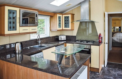 Arnold House | Modern holiday home with master double and a twin bedroom.