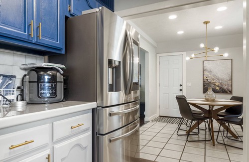 South Tulsa House | Modern space in south Tulsa w/outdoor firepit, kitchen, turf, & string lights!