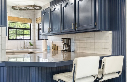 South Tulsa House | Modern space in south Tulsa w/outdoor firepit, kitchen, turf, & string lights!