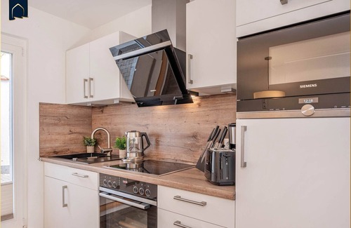 Kamminke Apartment | Modern vacation apartment by the lake with terrace and garden view on Usedom