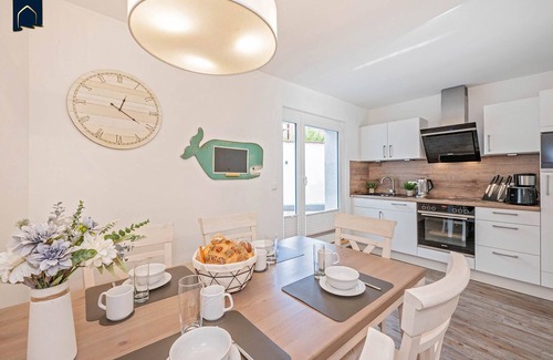 Kamminke Apartment | Modern vacation apartment by the lake with terrace and garden view on Usedom