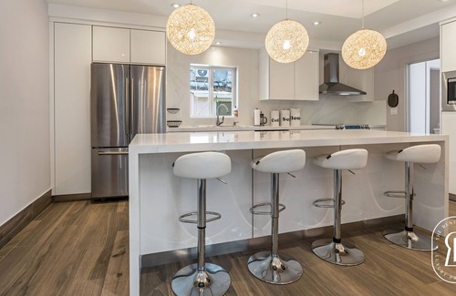 Surfside Villa | Modern Waterfront Villa in the Heart of Surfside with heated pool on the bay