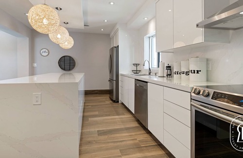 Surfside Villa | Modern Waterfront Villa in the Heart of Surfside with heated pool on the bay