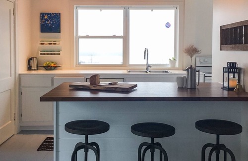 Amherst House | Modernized Waterfront Farmhouse with Wood Stove on 9 Acres of Land